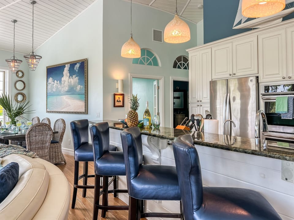Pull up a stool at the kitchen island - it's where the appetizers land, the kids sneak fresh fruit, tropical drinks are mixed, and the cook stays in the conversation.