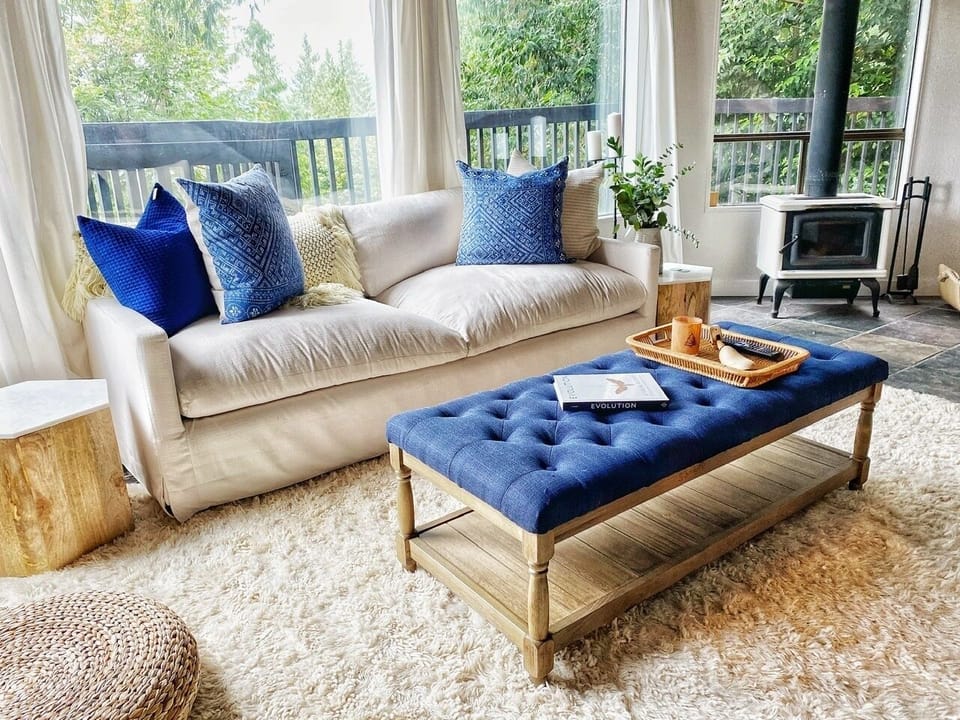 COmfortable couch and wood-burning stove for colder months