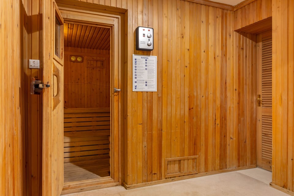 Unwind in the warm, wood-lined sauna—perfect after a day of exploring or poolside lounging.
