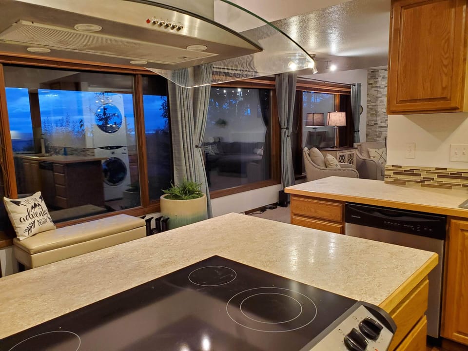 Kitchen cooktop looking out the picture windows