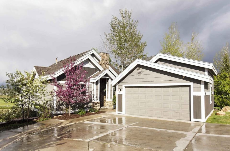 Front of house with 2 car parking garage and 2 additional space on front drive. 