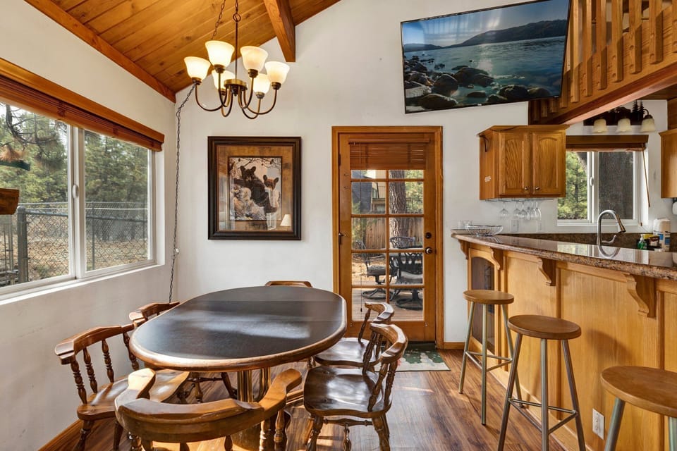 Fully equipped cabin kitchen with ample cabinetry, stove, fridge, microwave, and coffee maker—perfect for cooking meals, morning coffee, and feeling right at home on your stay.