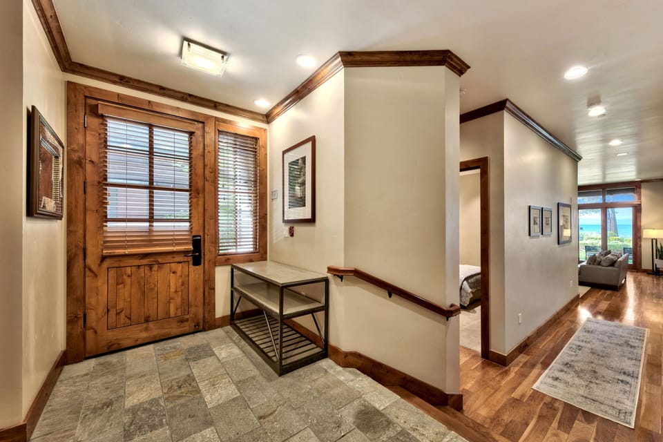 Beautiful entrance features a shoe rack and handle rail for ease during the winter.