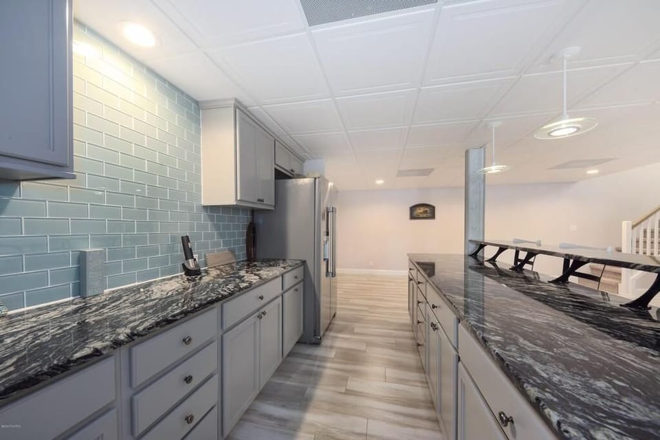 Downstairs bar with full size fridge and freezer (with ice maker)