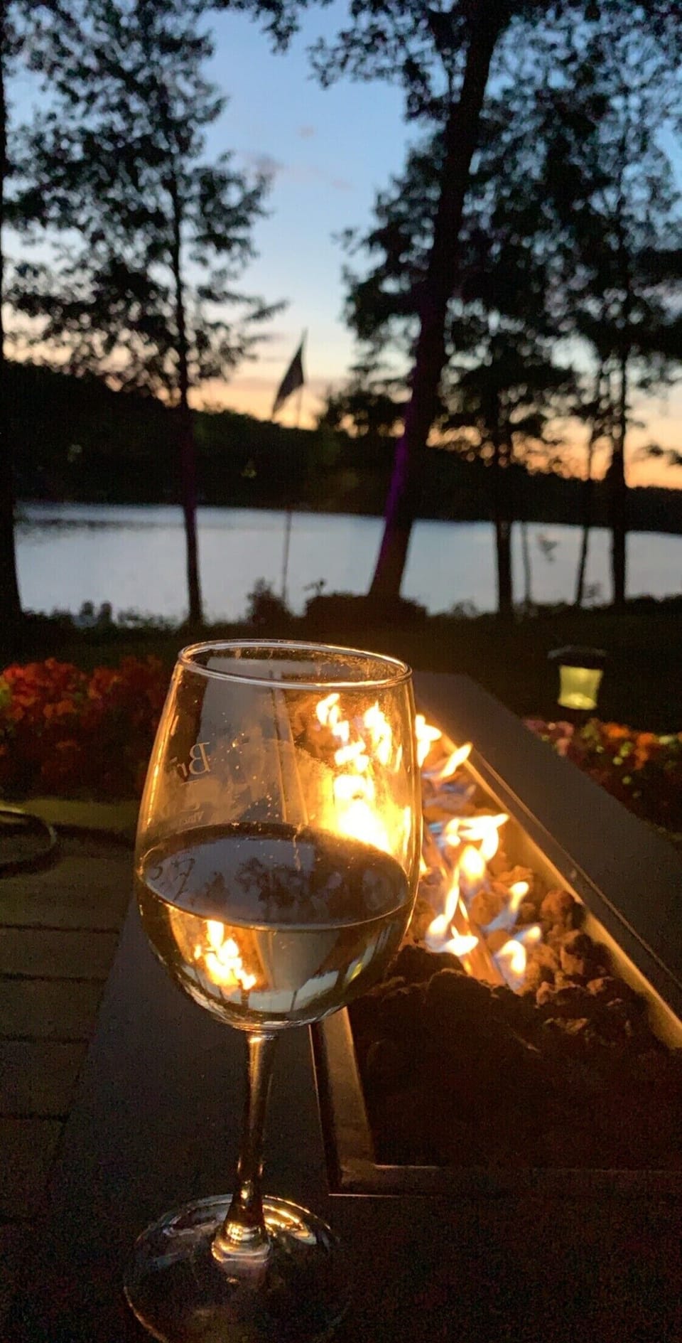 Gas fire pit overlooking the lake on the lower level, walkout deck