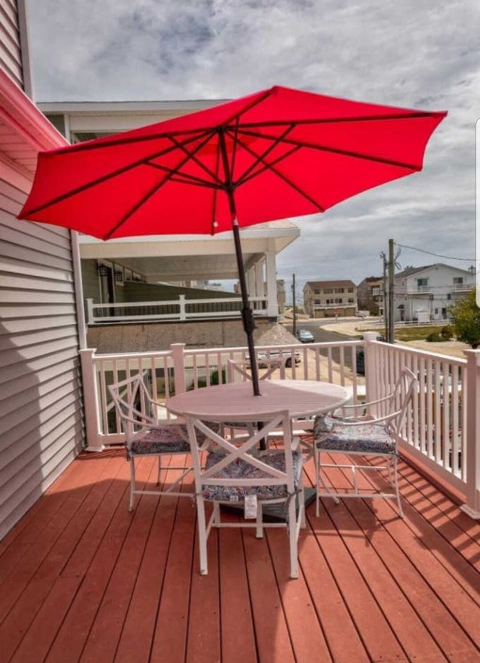 Deck view toward the ocean, entrance to beach is visible.