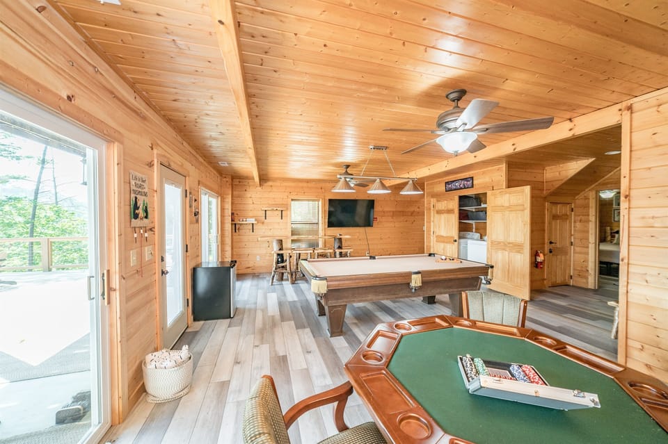 Basement area with pool table and bar area