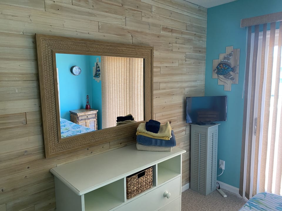 Dresser/ storage in queen bedroom #2 with a smart tv.