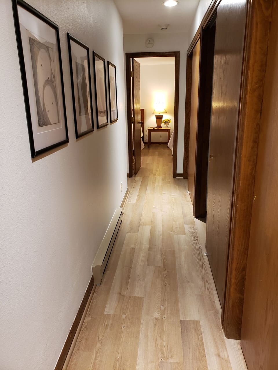 Hallway leading to guest bedroom, washer and dryer