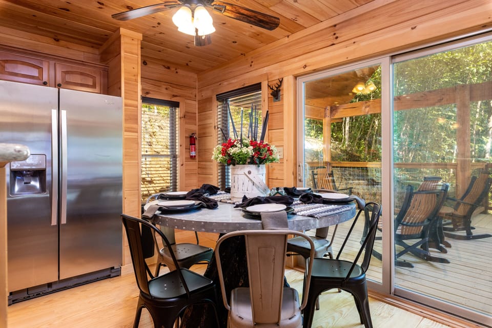 Dining area with seating for 5. Additional dining are outdoors or at kitchen bar