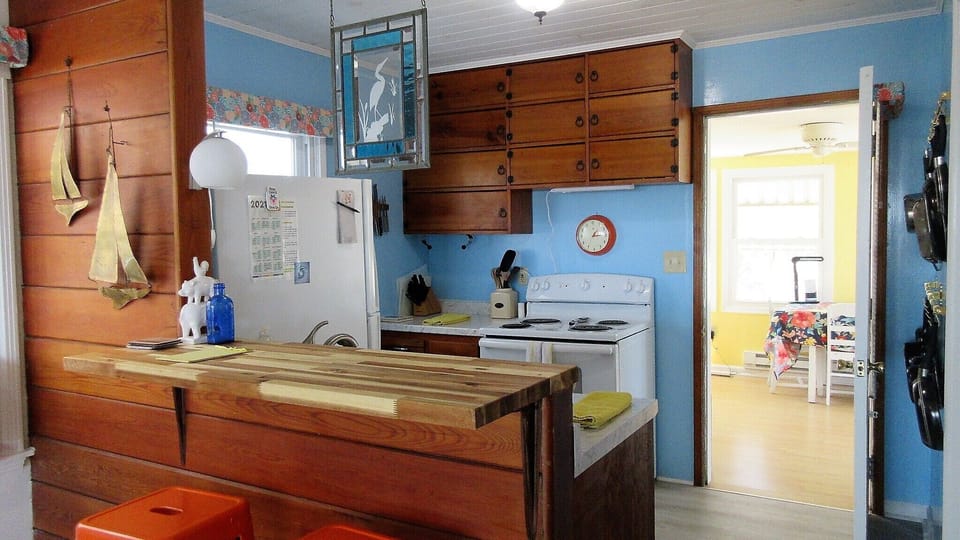 Butcher block breakfast bar is perfect for a relaxing morning breakfast w/ view!