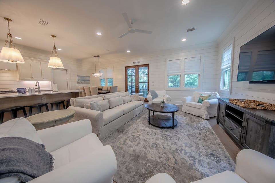 Spacious main floor living room with plenty of seating and smart tv- You Tube TV