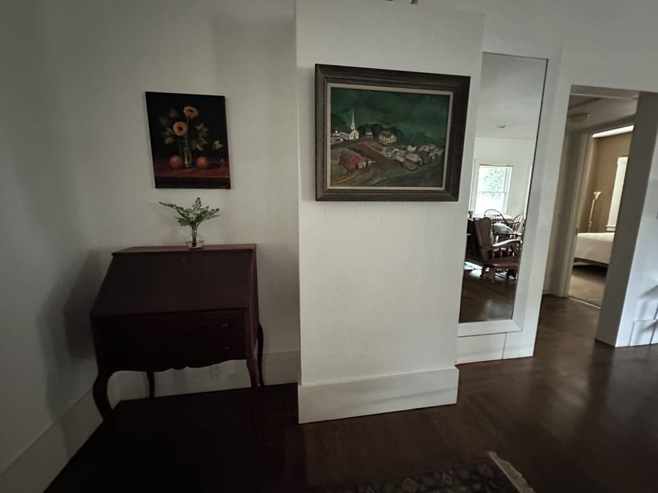 Exquisite antiques, authentic art pieces and a space enlarging mirror