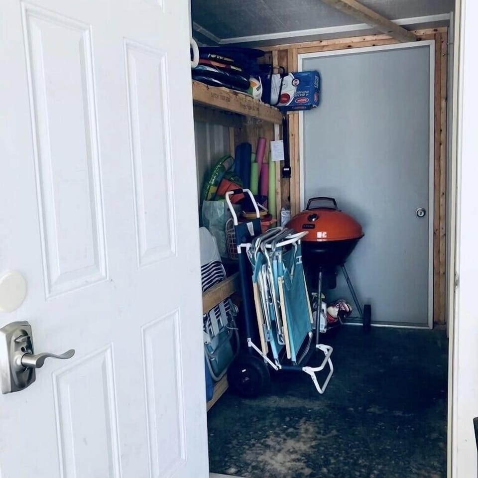 Storage area with beach chairs, toys, etc. Charcoal grill available to use.