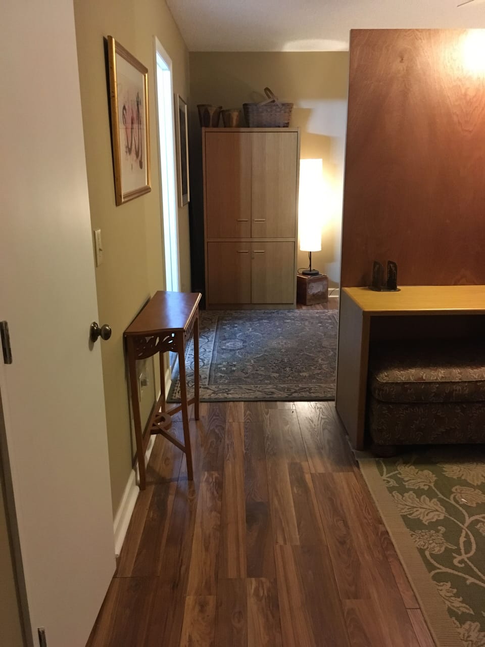 Suite hallway from living area to sleeping area and private bath with jetted tub