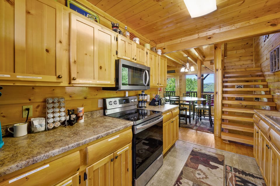 Enter through the well-equipped kitchen with new stainless steel appliances. 