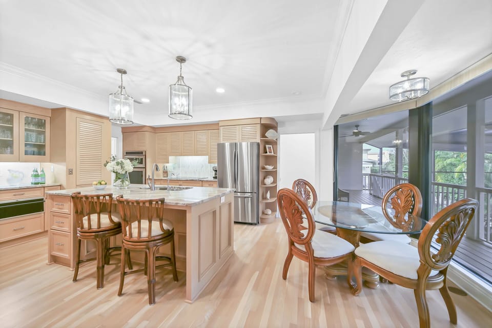 Chef's Open Kitchen with New Appliances Overlooking Pool Area
