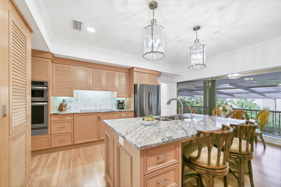 Chef's Open Kitchen with New Appliances Overlooking Pool Area