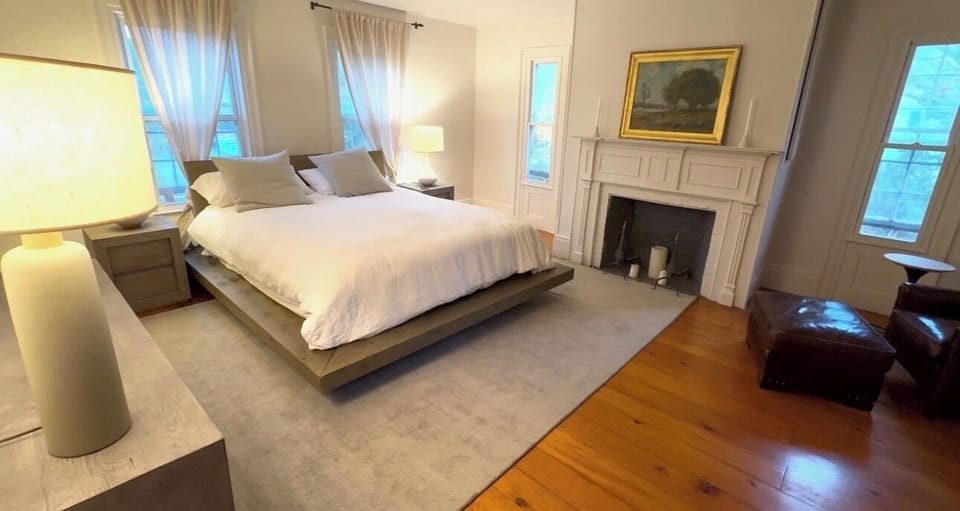 Master Bedroom 1 with en suite bathroom, linen drapes/bedding, RH full mirror.