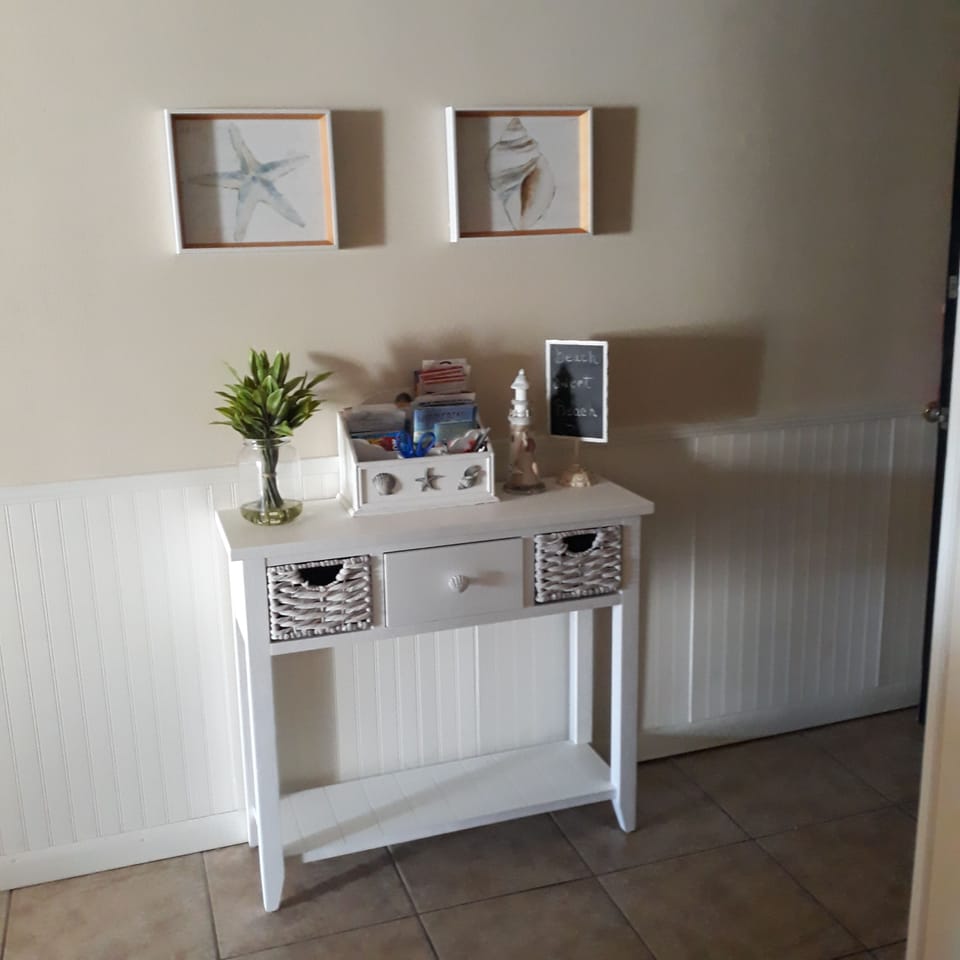 Entry way stocked with local restaurant menus and area coupon books 