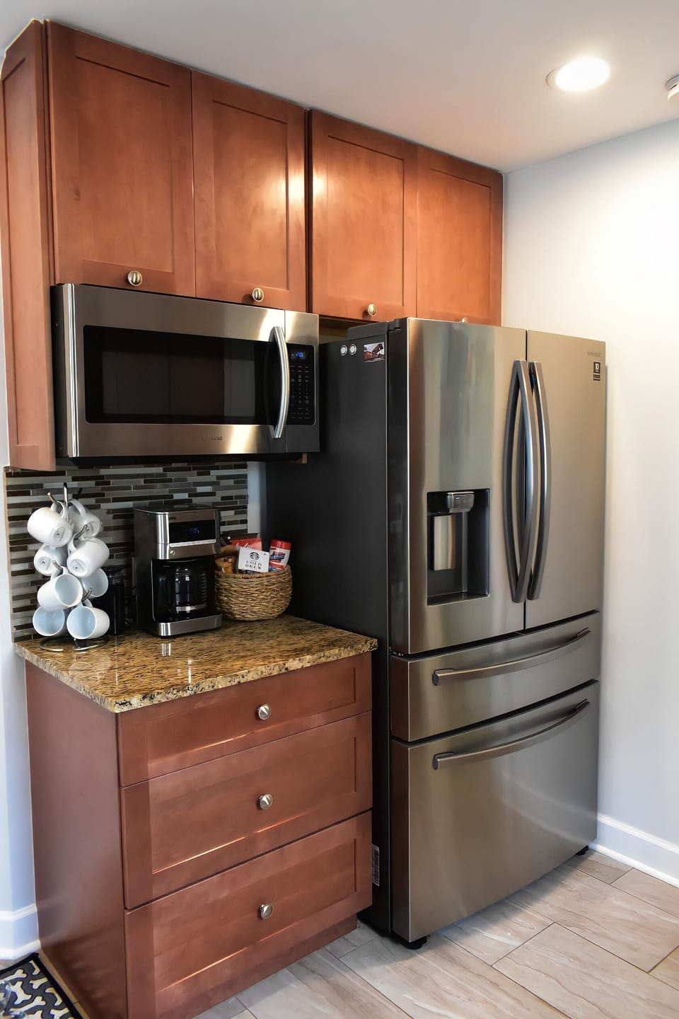 New refrigerator with water filter and ice machine as well as a coffee station.
