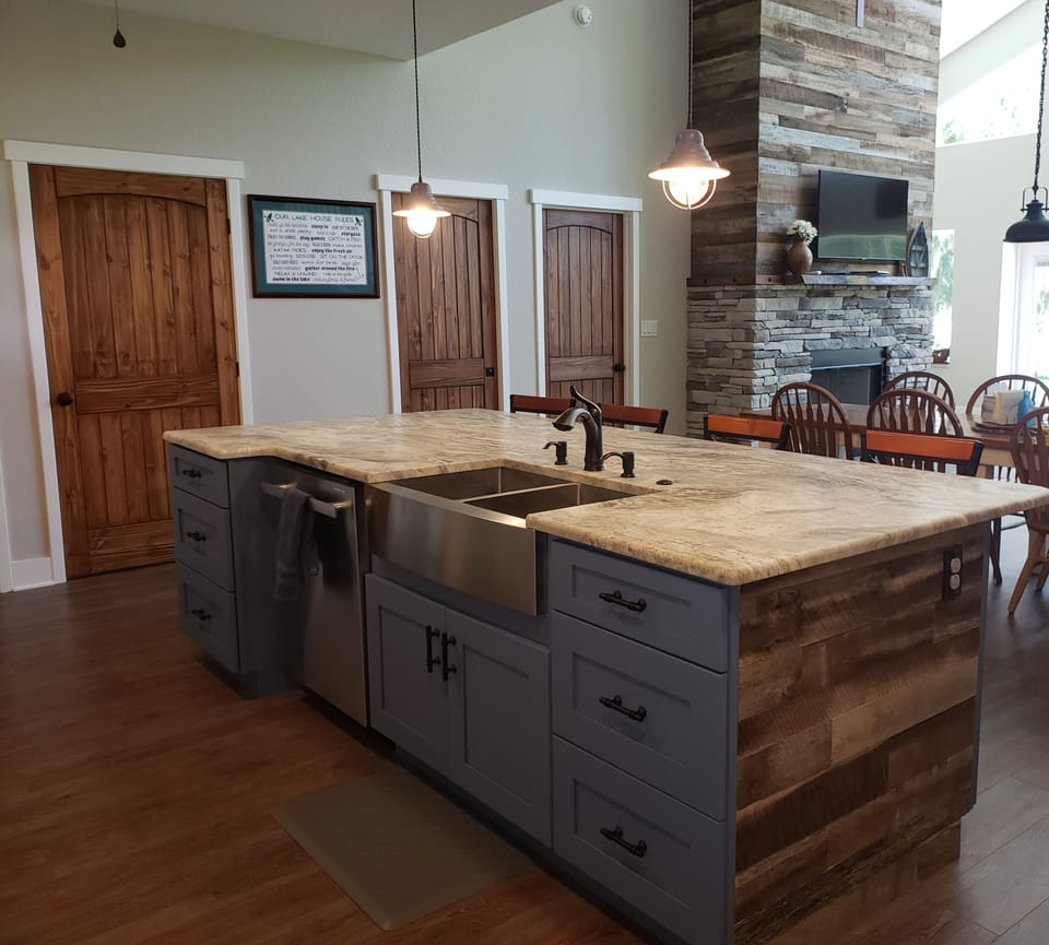 Kitchen island into the dining room.