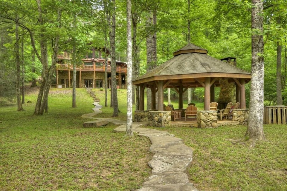 Walk on stone pathway to the river and river gazebo.