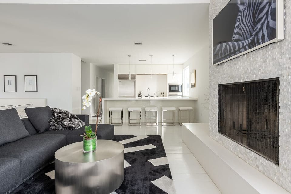 Living room with big sectional and 55" Samsung Frame TV.