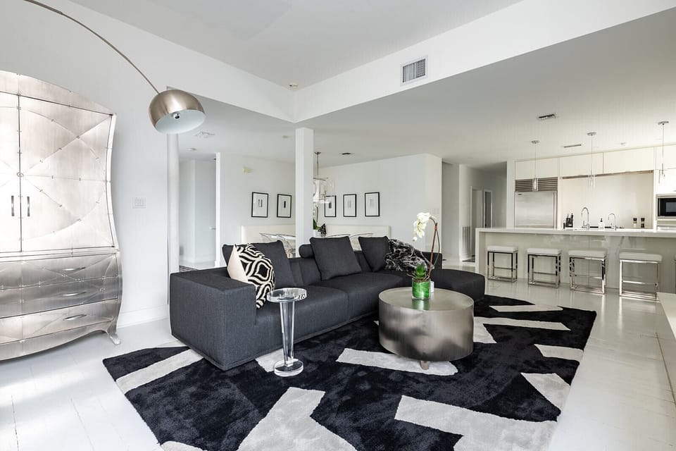 Living room with big sectional and 55" Samsung Frame TV.