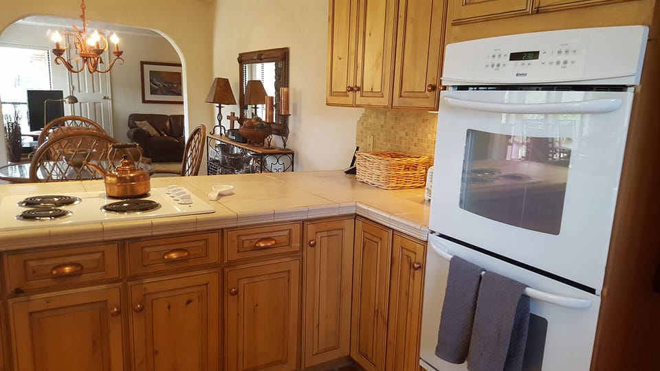 The kitchen features a double oven, plenty of counter space and cupboards