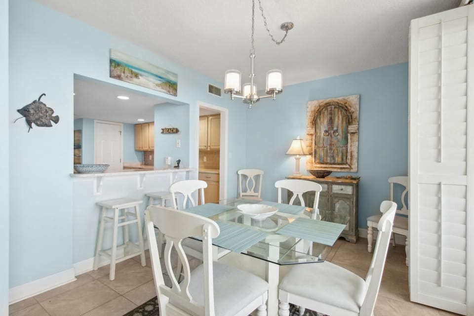 Glass Topped Dining Table Offering Seating for Six
