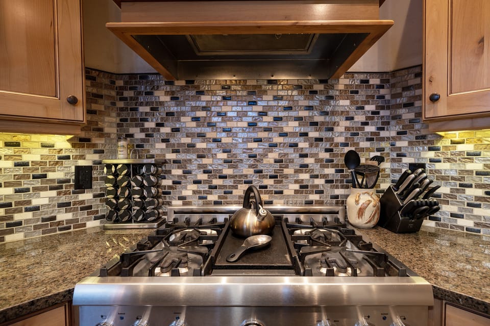 Modern kitchen with a 4 burner stove top and center griddle