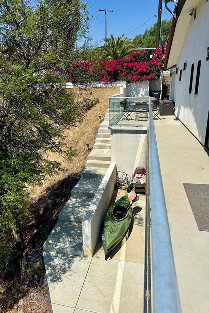 Not considered stairs by building code. Slope with steps and no handrail.