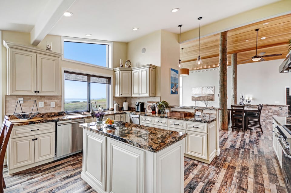 Open kitchen with granite counter tops and stainless steel appliances