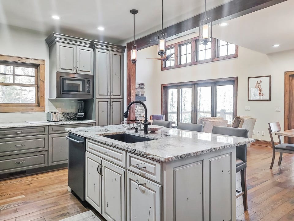 Kitchen with Upscale Brushed Nickel Appliances and a Gas Cooktop
