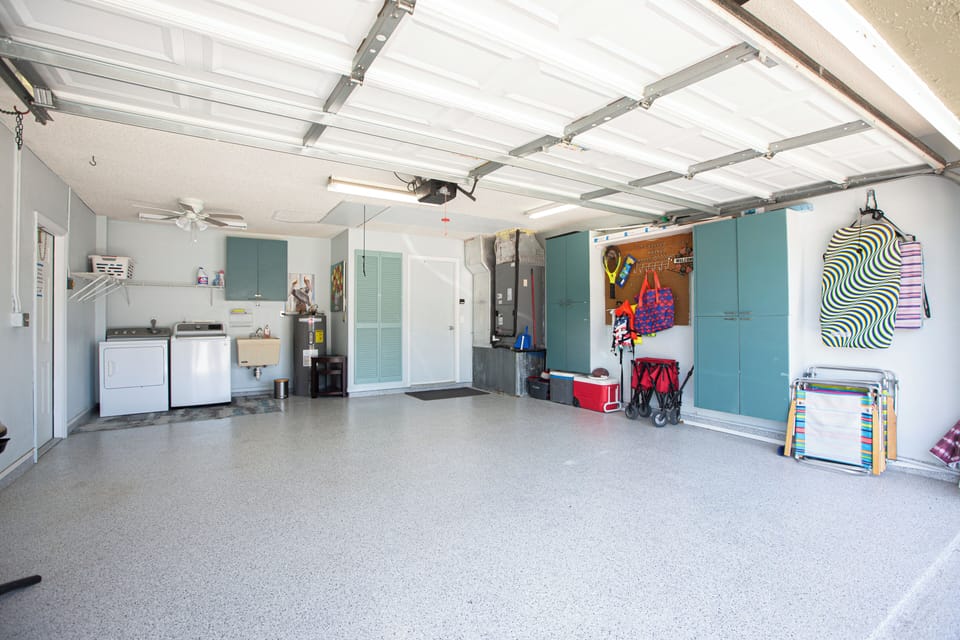 Garage with washer and dryer and beach equipment 