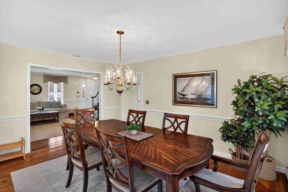 Your elegant dining space features rich hardwood floors and a beautiful chandelier, perfect for memorable meals together.
