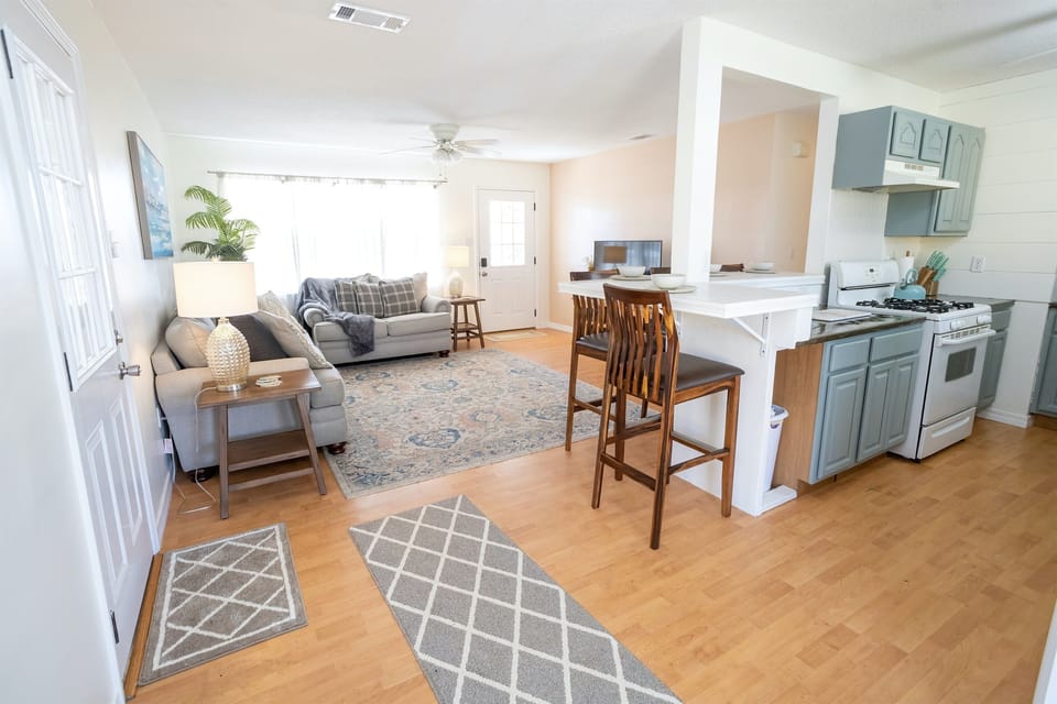 - Open concept layout featuring a well appointed kitchen and dining bar - Natural light fills the space, complementing the tasteful furnishings and clean design - Ideal for both short stays and extended visits with comfort and functionality in mind