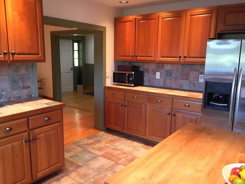 Kitchen with view into dining room and entryway. 