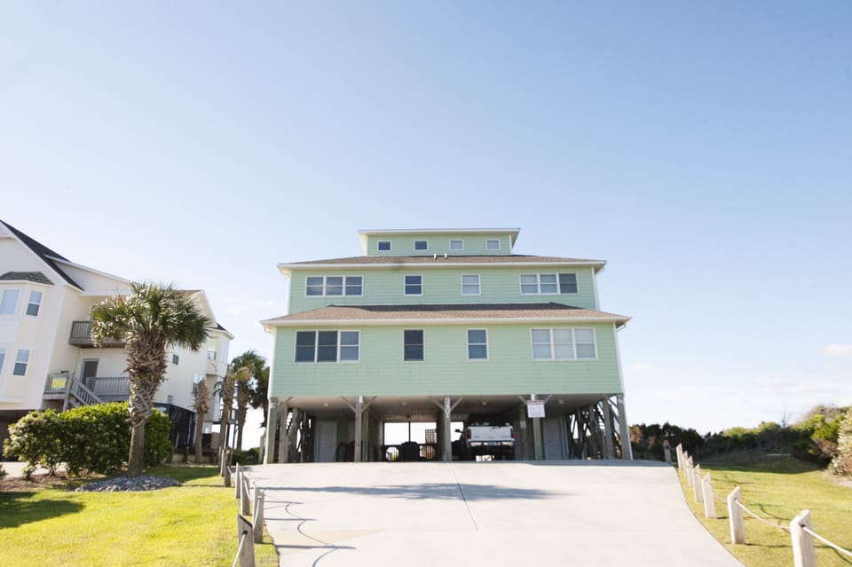 Drive up to the East side and enjoy shaded parking under the carport. 