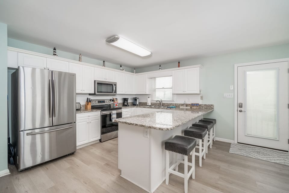 Kitchen also provides additional counter seating for 4