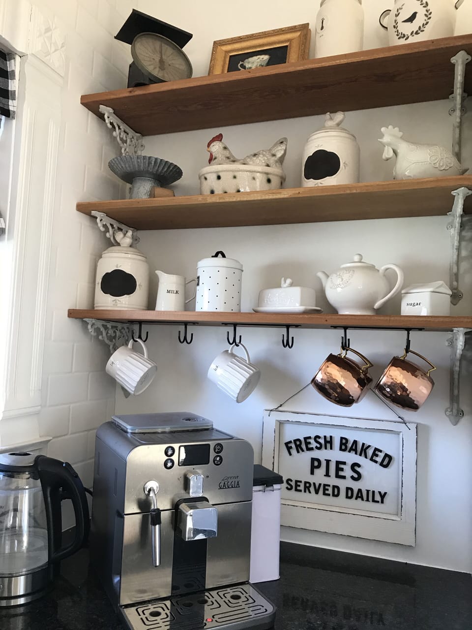 Open kitchen shelving. Super automatic espresso machine.