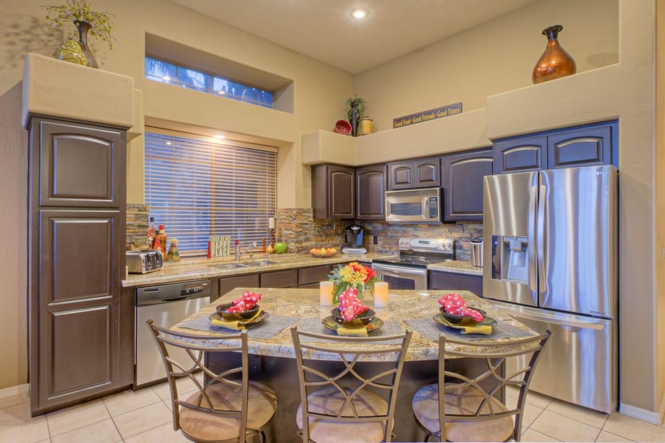 Island seating in kitchen is perfect for cocktail sipping or catching a quick snack or meal.