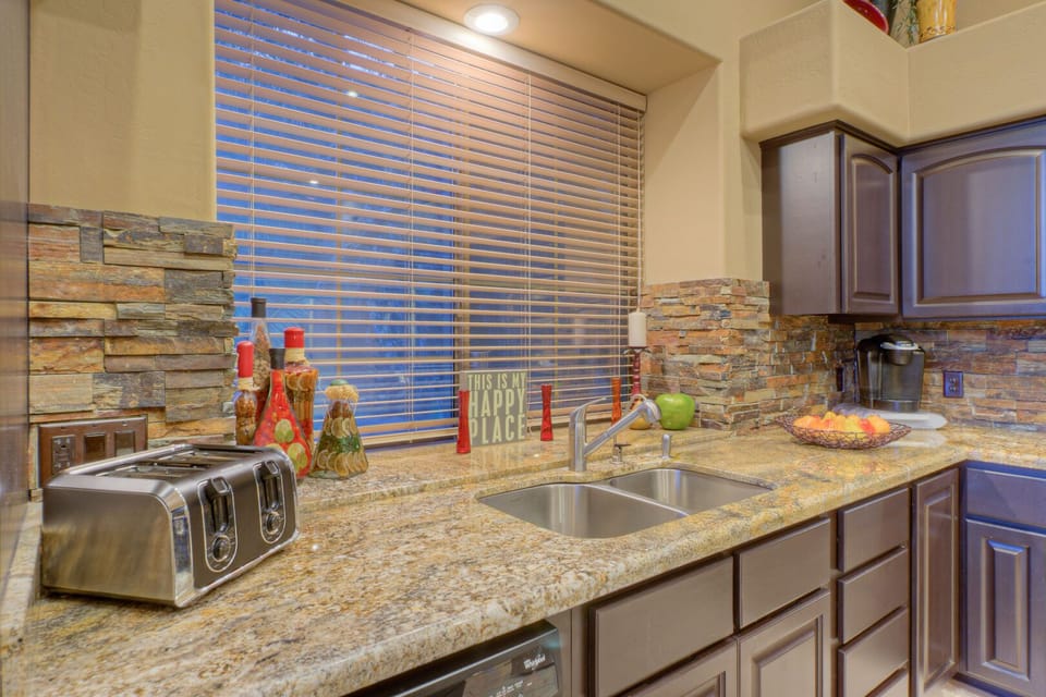 Kitchen is well stocked and includes ample counter space for food preps.