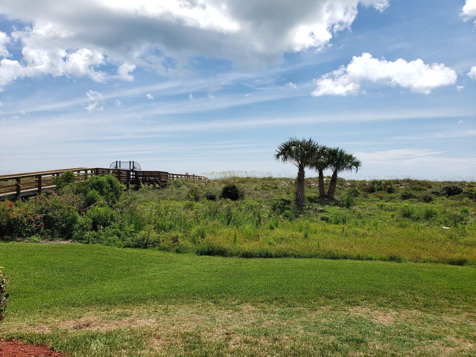 View from back patio, you can see the beach walkover.