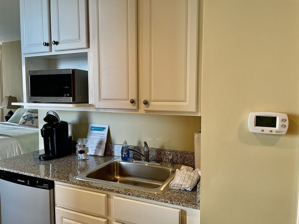 Small fridge, microwave and Keurig coffee maker