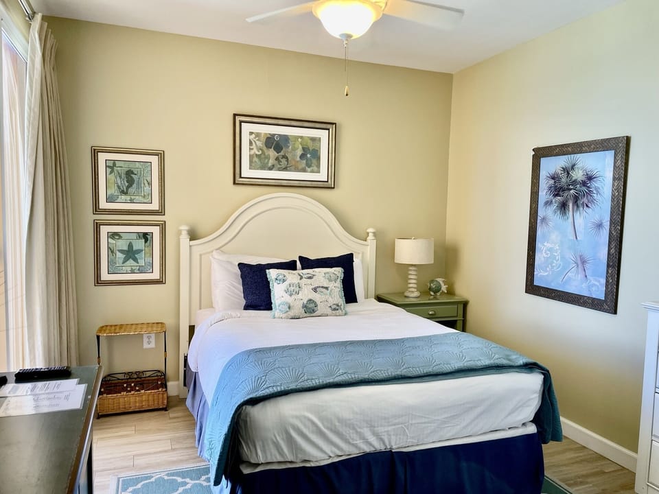 Queen size bed in guest bedroom