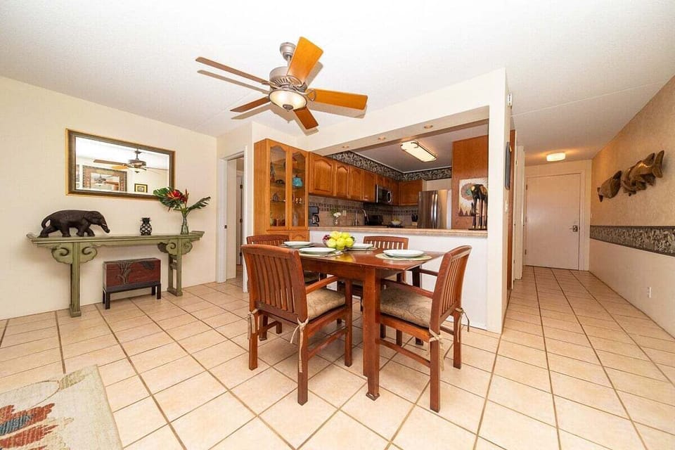 Dining space with tropical touches and nearby oceanview lanai access.