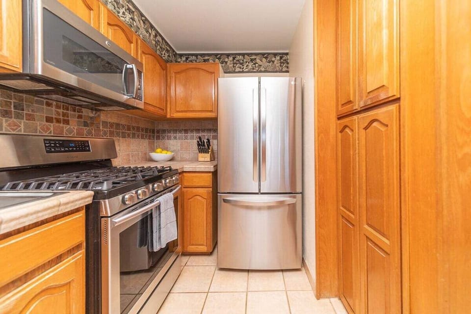 Fully equipped kitchen with new appliances and ample counter space.
