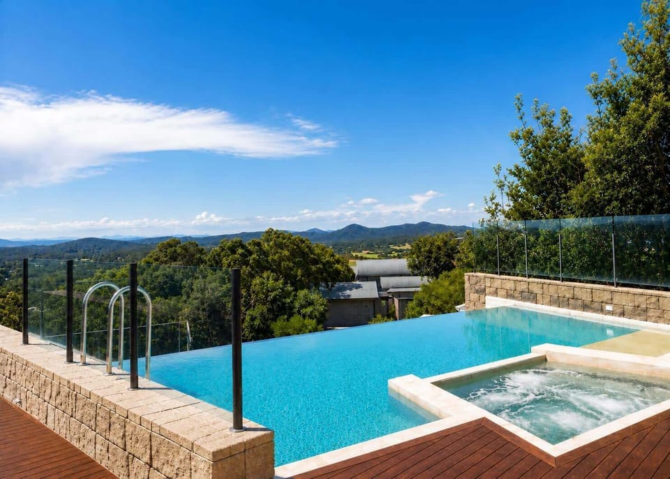 Shared Infinity edge pool with spa. Solar heated. Open 7:00am to 9:00pm.